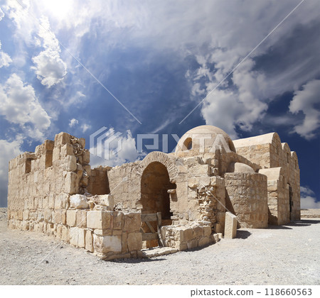 Quseir (Qasr) Amra desert castle (against the sky with clouds) near Amman, Jordan. World heritage with famous fresco's. Built in 8th century, of early Islamic art and architecture Quseir (Qasr) Amra desert castle (against the sky with clouds) near Amman, Jordan. World heritage with famous fresco's. Built in 8th century, of early Islamic art and architecture 118660563