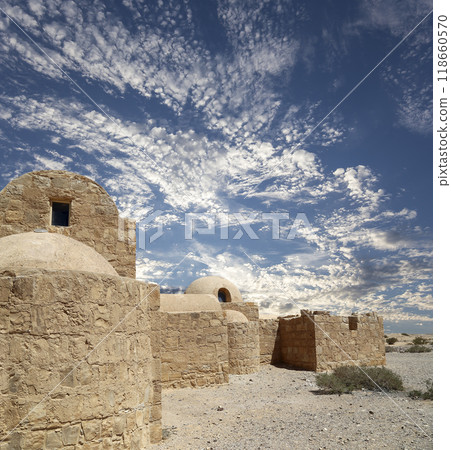 Quseir (Qasr) Amra desert castle (against the sky with clouds) near Amman, Jordan. World heritage with famous fresco's. Built in 8th century,  of early Islamic art and architecture 118660570