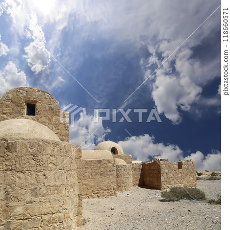Quseir (Qasr) Amra desert castle (against the sky with clouds) near Amman, Jordan. World heritage with famous fresco's. Built in 8th century,  of early Islamic art and architecture 118660571