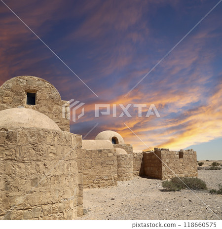 Quseir (Qasr) Amra desert castle (against the sky with clouds) near Amman, Jordan. World heritage with famous fresco's. Built in 8th century, of early Islamic art and architecture Quseir (Qasr) Amra desert castle (against the sky with clouds) near Amman, Jordan. World heritage with famous fresco's. Built in 8th century, of early Islamic art and architecture 118660575