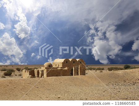 Quseir (Qasr) Amra desert castle (against the sky with clouds) near Amman, Jordan. World heritage with famous fresco's. Built in 8th century, of early Islamic art and architecture Quseir (Qasr) Amra desert castle (against the sky with clouds) near Amman, Jordan. World heritage with famous fresco's. Built in 8th century, of early Islamic art and architecture 118660585
