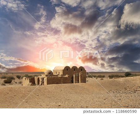 Quseir (Qasr) Amra desert castle (against the sky with clouds) near Amman, Jordan. World heritage with famous fresco's. Built in 8th century, of early Islamic art and architecture Quseir (Qasr) Amra desert castle (against the sky with clouds) near Amman, Jordan. World heritage with famous fresco's. Built in 8th century, of early Islamic art and architecture 118660590