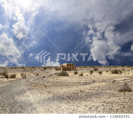 Quseir (Qasr) Amra desert castle (against the sky with clouds) near Amman, Jordan. World heritage with famous fresco's. Built in 8th century,  of early Islamic art and architecture 118660592