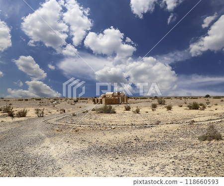 Quseir (Qasr) Amra desert castle (against the sky with clouds) near Amman, Jordan. World heritage with famous fresco's. Built in 8th century, of early Islamic art and architecture Quseir (Qasr) Amra desert castle (against the sky with clouds) near Amman, Jordan. World heritage with famous fresco's. Built in 8th century, of early Islamic art and architecture 118660593