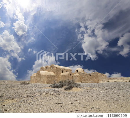 Quseir (Qasr) Amra desert castle (against the sky with clouds) near Amman, Jordan. World heritage with famous fresco's. Built in 8th century, of early Islamic art and architecture Quseir (Qasr) Amra desert castle (against the sky with clouds) near Amman, Jordan. World heritage with famous fresco's. Built in 8th century, of early Islamic art and architecture 118660599