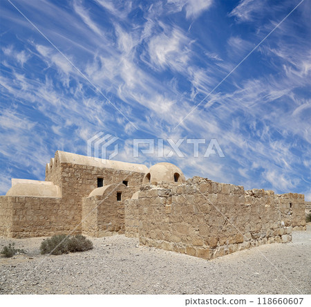 Quseir (Qasr) Amra desert castle (against the sky with clouds) near Amman, Jordan. World heritage with famous fresco's. Built in 8th century, of early Islamic art and architecture Quseir (Qasr) Amra desert castle (against the sky with clouds) near Amman, Jordan. World heritage with famous fresco's. Built in 8th century, of early Islamic art and architecture 118660607