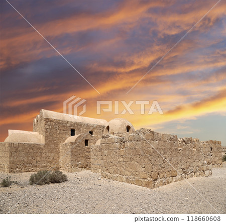 Quseir (Qasr) Amra desert castle (against the sky with clouds) near Amman, Jordan. World heritage with famous fresco's. Built in 8th century, of early Islamic art and architecture Quseir (Qasr) Amra desert castle (against the sky with clouds) near Amman, Jordan. World heritage with famous fresco's. Built in 8th century, of early Islamic art and architecture 118660608