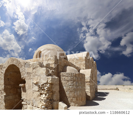 Quseir (Qasr) Amra desert castle (against the sky with clouds) near Amman, Jordan. World heritage with famous fresco's. Built in 8th century,  of early Islamic art and architecture 118660612