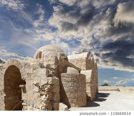 Quseir (Qasr) Amra desert castle (against the sky with clouds) near Amman, Jordan. World heritage with famous fresco's. Built in 8th century, of early Islamic art and architecture Quseir (Qasr) Amra desert castle (against the sky with clouds) near Amman, Jordan. World heritage with famous fresco's. Built in 8th century, of early Islamic art and architecture 118660614