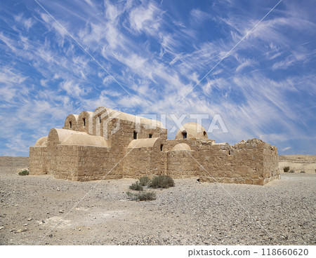 Quseir (Qasr) Amra desert castle (against the sky with clouds) near Amman, Jordan. World heritage with famous fresco's. Built in 8th century, of early Islamic art and architecture Quseir (Qasr) Amra desert castle (against the sky with clouds) near Amman, Jordan. World heritage with famous fresco's. Built in 8th century, of early Islamic art and architecture 118660620