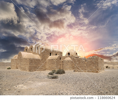 Quseir (Qasr) Amra desert castle (against the sky with clouds) near Amman, Jordan. World heritage with famous fresco's. Built in 8th century, of early Islamic art and architecture Quseir (Qasr) Amra desert castle (against the sky with clouds) near Amman, Jordan. World heritage with famous fresco's. Built in 8th century, of early Islamic art and architecture 118660624