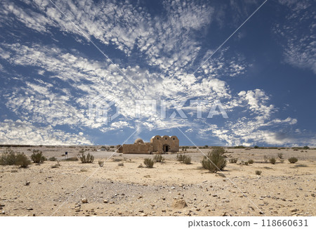 Quseir (Qasr) Amra desert castle (against the sky with clouds) near Amman, Jordan. World heritage with famous fresco's. Built in 8th century,  of early Islamic art and architecture 118660631