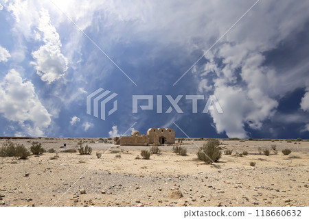 Quseir (Qasr) Amra desert castle (against the sky with clouds) near Amman, Jordan. World heritage with famous fresco's. Built in 8th century, of early Islamic art and architecture Quseir (Qasr) Amra desert castle (against the sky with clouds) near Amman, Jordan. World heritage with famous fresco's. Built in 8th century, of early Islamic art and architecture 118660632