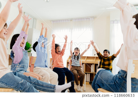 Excited primary school kids from various backgrounds express happiness together. Cheerful classroom scene captures essence of modern education, highlighting unity and active participation Excited primary school kids from various backgrounds express happiness together. Cheerful classroom scene captures essence of modern education, highlighting unity and active participation 118660633