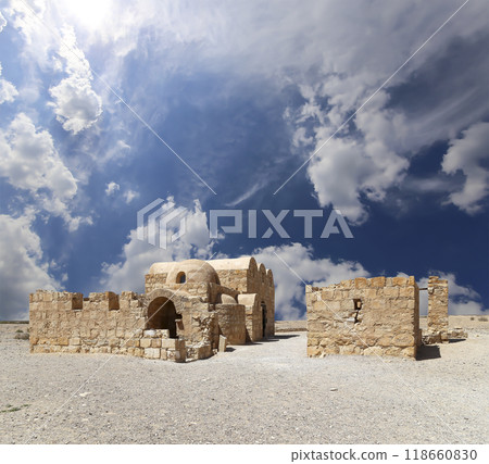 Quseir (Qasr) Amra desert castle (against the sky with clouds) near Amman, Jordan. World heritage with famous fresco's. Built in 8th century, of early Islamic art and architecture Quseir (Qasr) Amra desert castle (against the sky with clouds) near Amman, Jordan. World heritage with famous fresco's. Built in 8th century, of early Islamic art and architecture 118660830