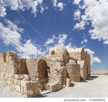 Quseir (Qasr) Amra desert castle (against the sky with clouds) near Amman, Jordan. World heritage with famous fresco's. Built in 8th century, of early Islamic art and architecture Quseir (Qasr) Amra desert castle (against the sky with clouds) near Amman, Jordan. World heritage with famous fresco's. Built in 8th century, of early Islamic art and architecture 118660842