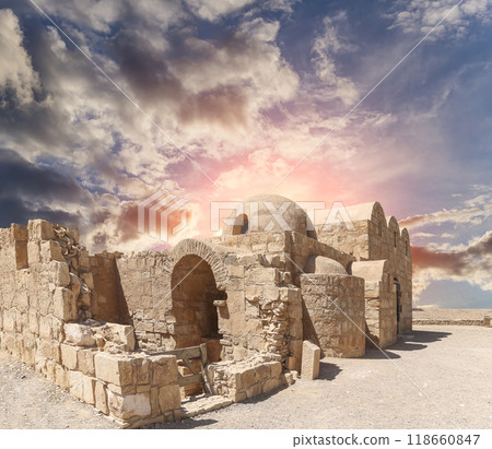 Quseir (Qasr) Amra desert castle (against the sky with clouds) near Amman, Jordan. World heritage with famous fresco's. Built in 8th century, of early Islamic art and architecture Quseir (Qasr) Amra desert castle (against the sky with clouds) near Amman, Jordan. World heritage with famous fresco's. Built in 8th century, of early Islamic art and architecture 118660847