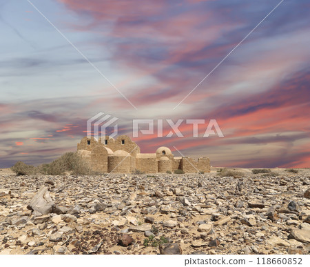 Quseir (Qasr) Amra desert castle (against the sky with clouds) near Amman, Jordan. World heritage with famous fresco's. Built in 8th century, of early Islamic art and architecture Quseir (Qasr) Amra desert castle (against the sky with clouds) near Amman, Jordan. World heritage with famous fresco's. Built in 8th century, of early Islamic art and architecture 118660852