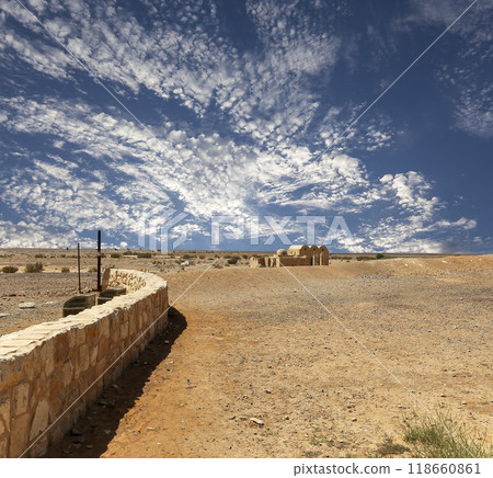 Quseir (Qasr) Amra desert castle (against the sky with clouds) near Amman, Jordan. World heritage with famous fresco's. Built in 8th century,  of early Islamic art and architecture 118660861