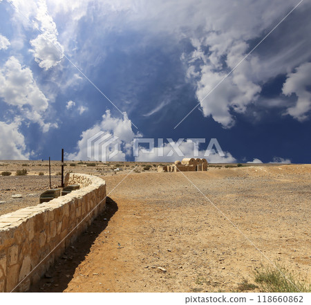 Quseir (Qasr) Amra desert castle (against the sky with clouds) near Amman, Jordan. World heritage with famous fresco's. Built in 8th century,  of early Islamic art and architecture 118660862