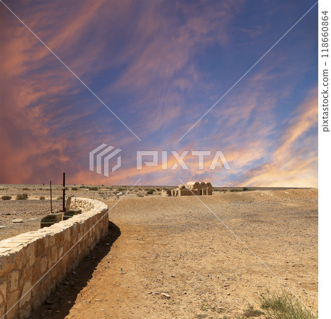 Quseir (Qasr) Amra desert castle (against the sky with clouds) near Amman, Jordan. World heritage with famous fresco's. Built in 8th century,  of early Islamic art and architecture 118660864