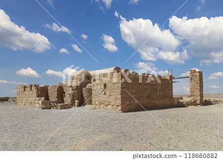Quseir (Qasr) Amra desert castle (against the sky with clouds) near Amman, Jordan. World heritage with famous fresco's. Built in 8th century, of early Islamic art and architecture Quseir (Qasr) Amra desert castle (against the sky with clouds) near Amman, Jordan. World heritage with famous fresco's. Built in 8th century, of early Islamic art and architecture 118660882