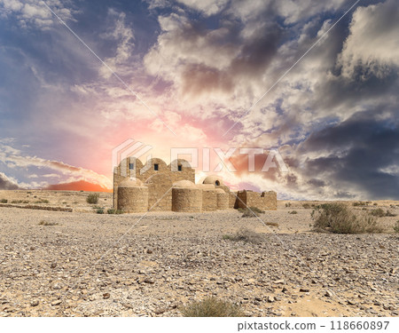 Quseir (Qasr) Amra desert castle (against the sky with clouds) near Amman, Jordan. World heritage with famous fresco's. Built in 8th century, of early Islamic art and architecture Quseir (Qasr) Amra desert castle (against the sky with clouds) near Amman, Jordan. World heritage with famous fresco's. Built in 8th century, of early Islamic art and architecture 118660897