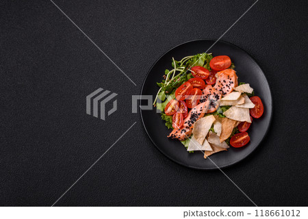 Delicious fresh caesar salad with salmon, lettuce, tomatoes and egg Delicious fresh caesar salad with salmon, lettuce, tomatoes and egg 118661012