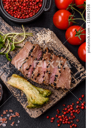 Bowl with slices of baked tuna with broccoli, tomatoes and fusili pasta Bowl with slices of baked tuna with broccoli, tomatoes and fusili pasta 118661056