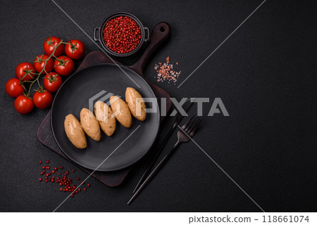 Fish or meat quenelles with delicate mushroom sauce, salt and spices Fish or meat quenelles with delicate mushroom sauce, salt and spices 118661074