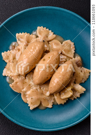 Fish or meat quenelles with delicate mushroom sauce, salt and spices Fish or meat quenelles with delicate mushroom sauce, salt and spices 118661093