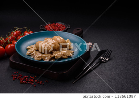 Fish or meat quenelles with delicate mushroom sauce, salt and spices Fish or meat quenelles with delicate mushroom sauce, salt and spices 118661097