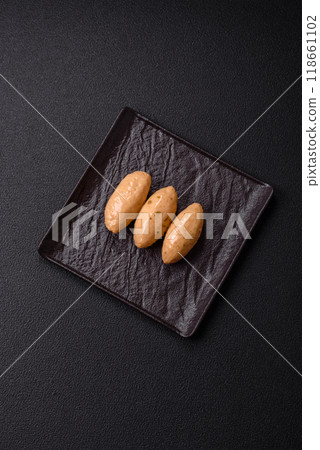 Fish or meat quenelles with delicate mushroom sauce, salt and spices 118661102