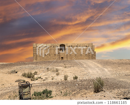 Qasr Kharana (Kharanah or Harrana)-- desert castle in eastern Jordan (100 km of Amman). Built in 8th century AD to be used as caravanserai, a resting place for traders. Against the sky with clouds Qasr Kharana (Kharanah or Harrana)-- desert castle in eastern Jordan (100 km of Amman). Built in 8th century AD to be used as caravanserai, a resting place for traders. Against the sky with clouds 118661185