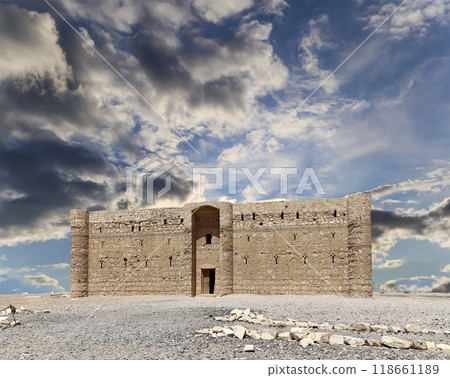 Qasr Kharana (Kharanah or Harrana)-- desert castle in eastern Jordan (100 km of Amman). Built in 8th century AD to be used as caravanserai, a resting place for traders. Against the sky with clouds Qasr Kharana (Kharanah or Harrana)-- desert castle in eastern Jordan (100 km of Amman). Built in 8th century AD to be used as caravanserai, a resting place for traders. Against the sky with clouds 118661189