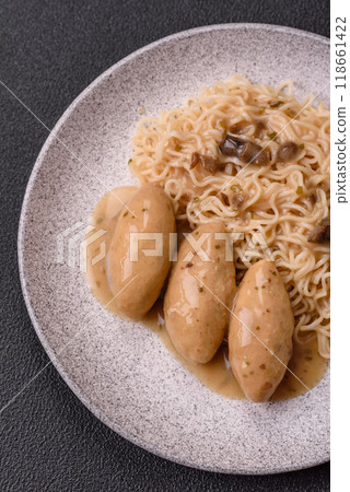 Fish or meat quenelles with vegetables, salt and spices in mushroom sauce Fish or meat quenelles with vegetables, salt and spices in mushroom sauce 118661422