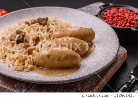 Fish or meat quenelles with vegetables, salt and spices in mushroom sauce 118661423