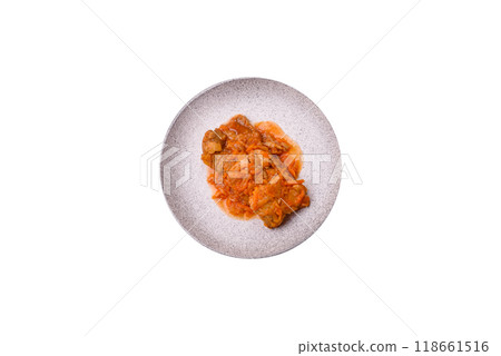 Sliced fish in tomato sauce with salt and spices 118661516
