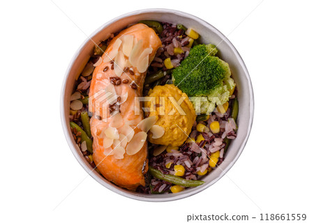 A piece of boiled salmon with rice, broccoli, salt and spices 118661559