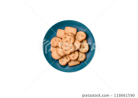 Delicious fresh sweet crispy butter cookies on a dark background Delicious fresh sweet crispy butter cookies on a dark background 118661590