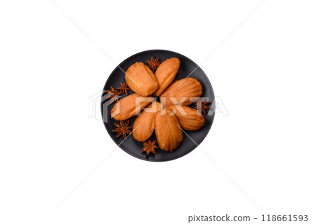 Traditional French madeleine biscuits with nutty flavor Traditional French madeleine biscuits with nutty flavor 118661593