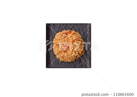 Delicious hot boiled wheat porridge couscous with vegetables 118661600