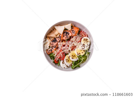 Delicious fresh caesar salad with salmon, lettuce, tomatoes and egg Delicious fresh caesar salad with salmon, lettuce, tomatoes and egg 118661603