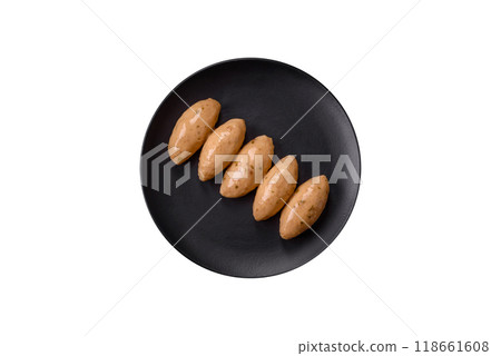 Fish or meat quenelles with delicate mushroom sauce, salt and spices Fish or meat quenelles with delicate mushroom sauce, salt and spices 118661608