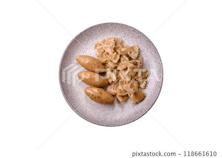 Fish or meat quenelles with delicate mushroom sauce, salt and spices 118661610