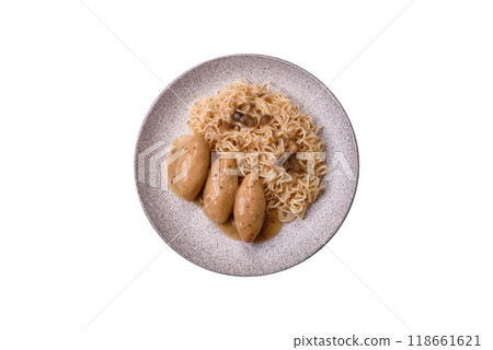 Fish or meat quenelles with vegetables, salt and spices in mushroom sauce Fish or meat quenelles with vegetables, salt and spices in mushroom sauce 118661621