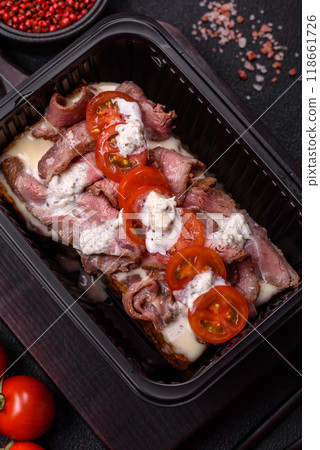 Sandwich with brioche bun, roast beef, tomatoes, stracciatello 118661726