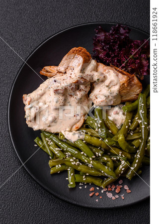 Asian food baked chicken breast with green beans, sesame seeds and sauce Asian food baked chicken breast with green beans, sesame seeds and sauce 118661924