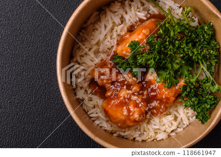 Asian food boiled rice with meat with sweet and sour sauce, spices and herbs 118661947