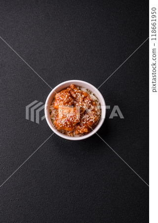 Asian food boiled rice with meat with sweet and sour sauce, spices and herbs Asian food boiled rice with meat with sweet and sour sauce, spices and herbs 118661950
